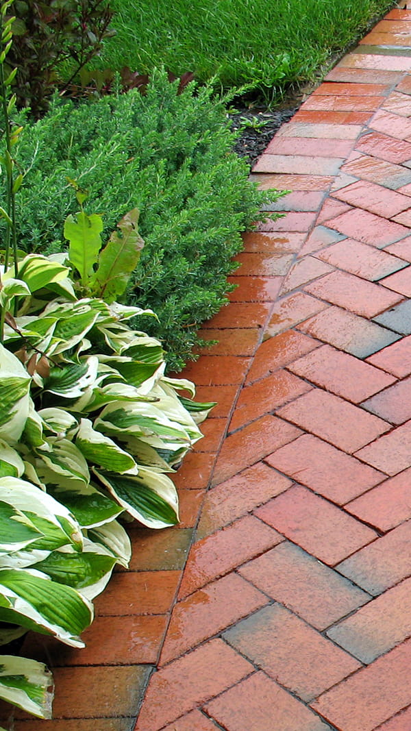 Custom-designed paver pathways installed in Colonia, New Jersey Paver sidewalks and walkways installed by Northeastern PMC in Colonia, New Jersey